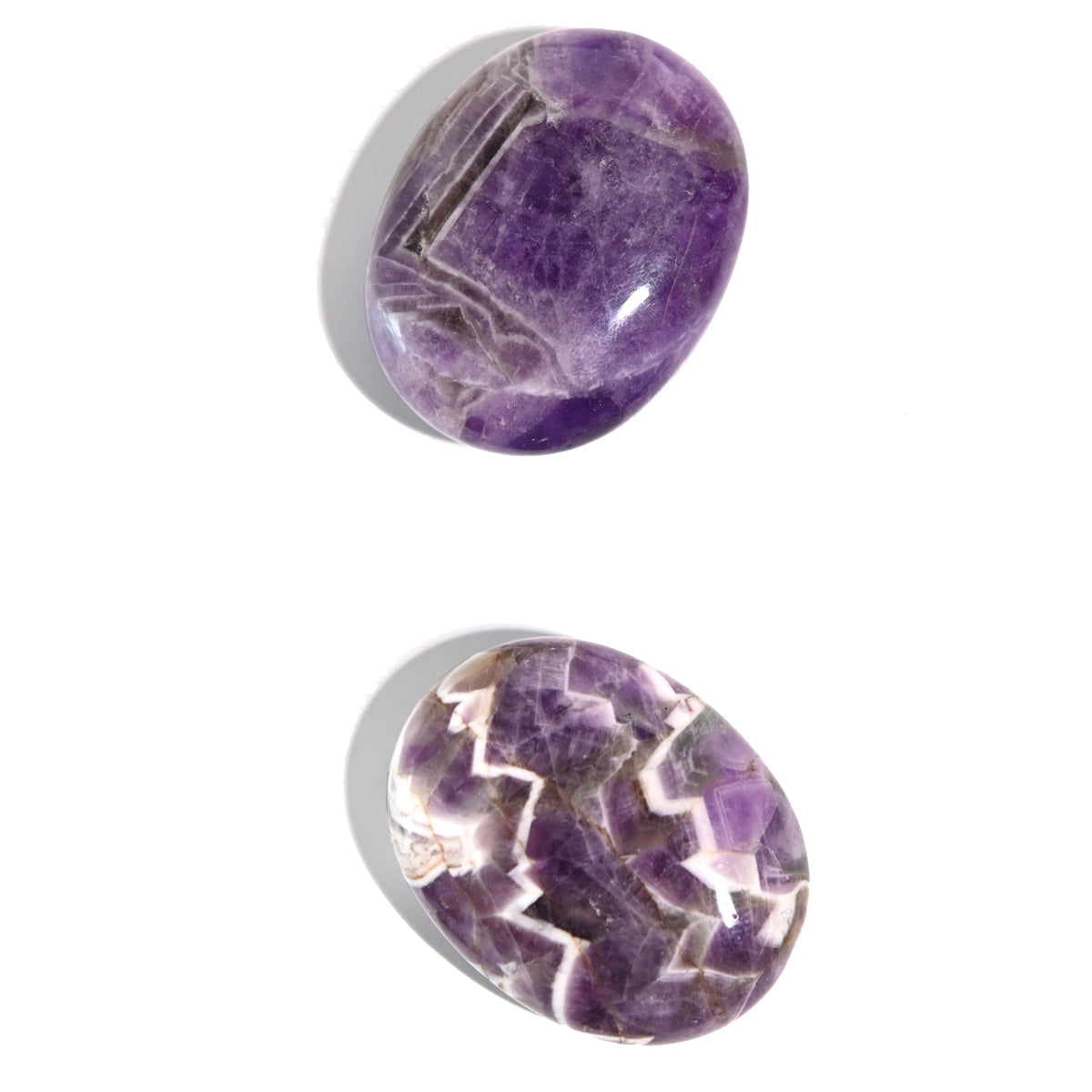 Chevron Dream Amethyst Palm Stone showing V-shaped purple and white banding