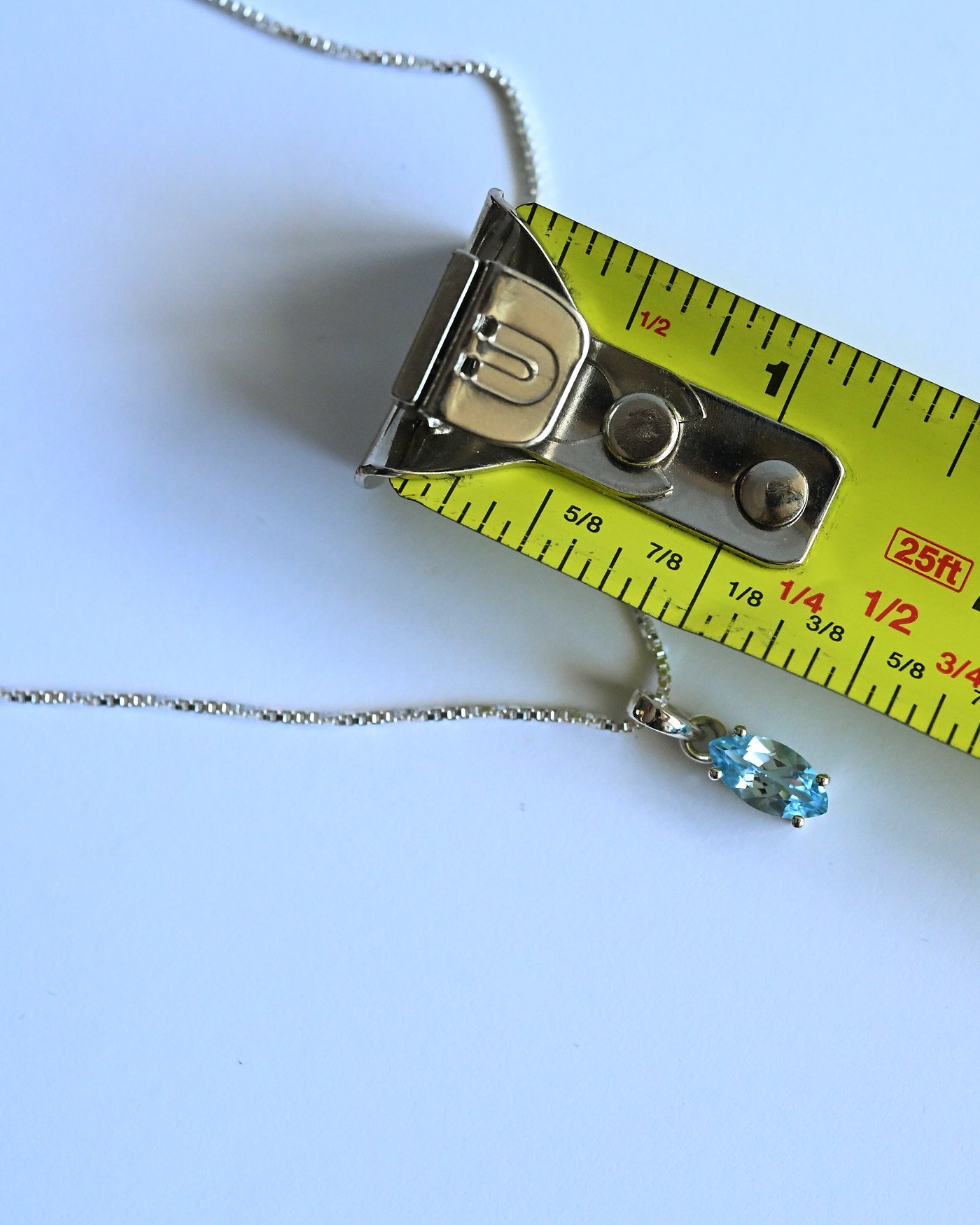 Blue Topaz Pendant size reference — approximately 3/4 inch marquise