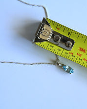 Blue Topaz Pendant size reference — approximately 3/4 inch marquise