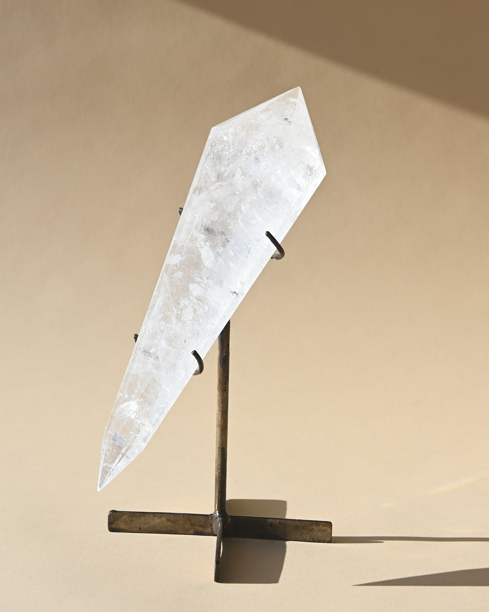 Clear Quartz Double Terminated Point on Stand - clear quartz crystal point styled in home