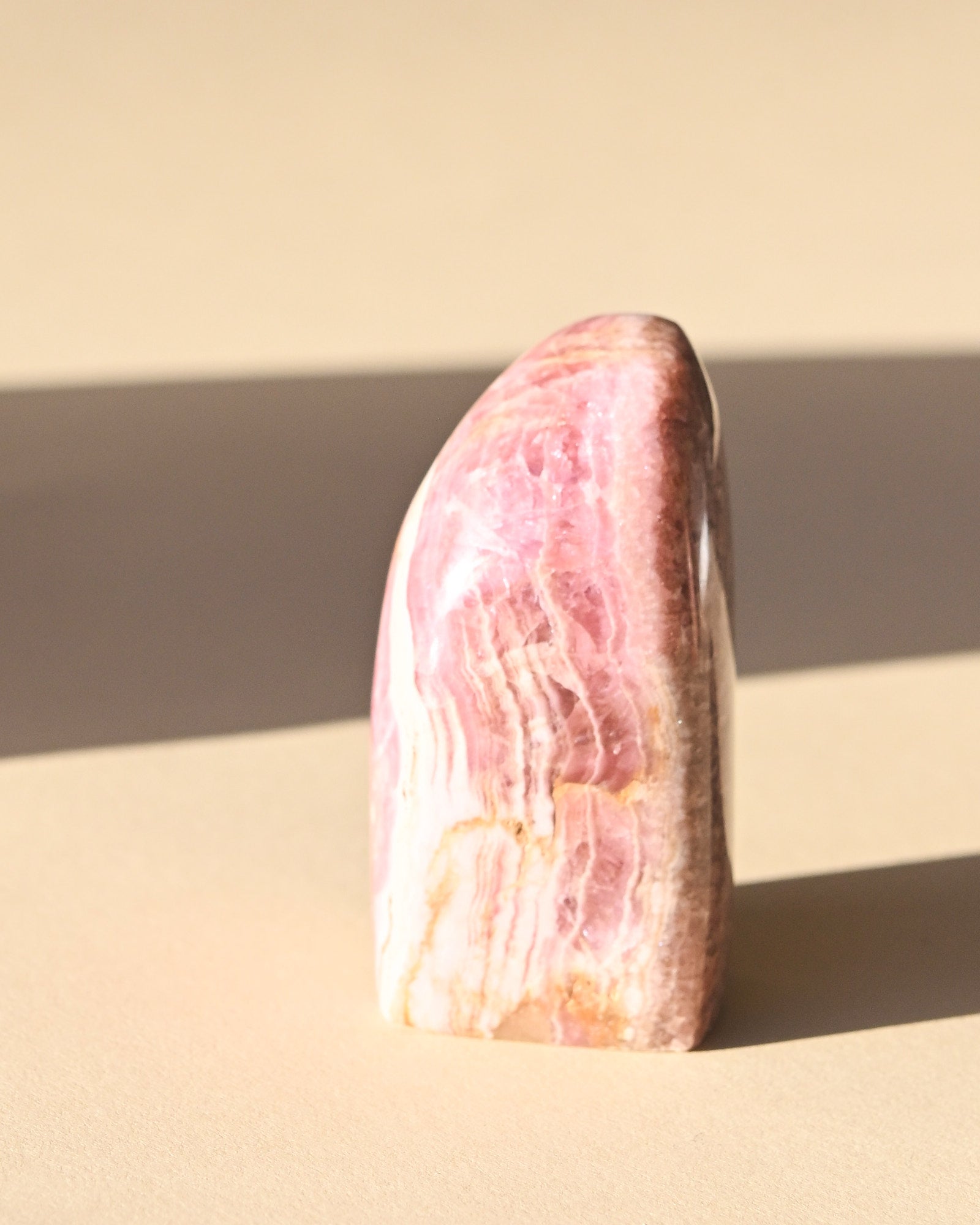 Rhodochrosite Polished Freeform - pyrite crystal freeform sculpture side view