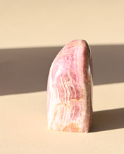 Rhodochrosite Polished Freeform - pyrite crystal freeform sculpture side view