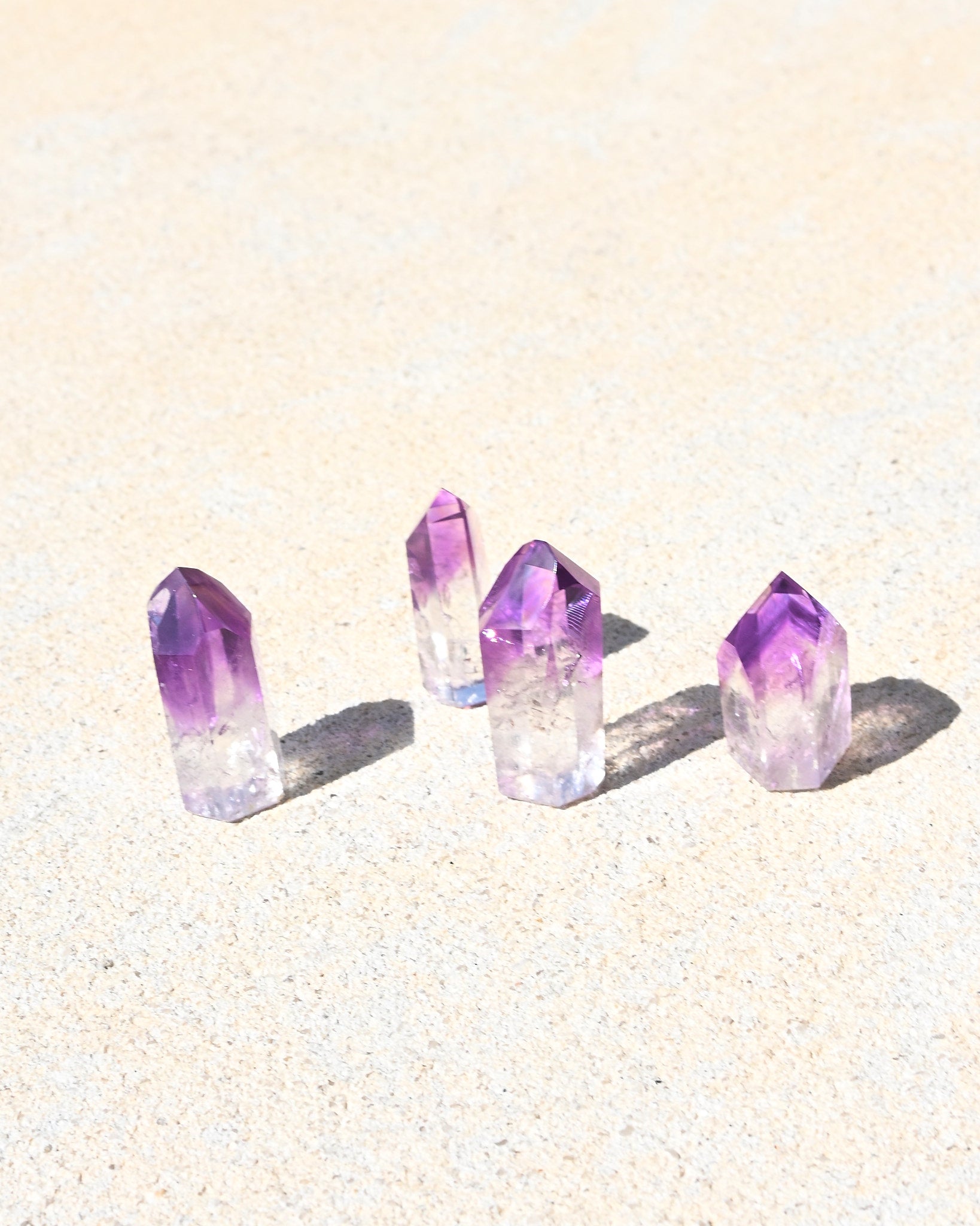 Mini Bahia Amethyst Phantom Point - natural amethyst crystal point in natural light