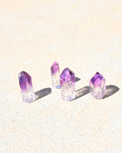 Mini Bahia Amethyst Phantom Point - natural amethyst crystal point in natural light