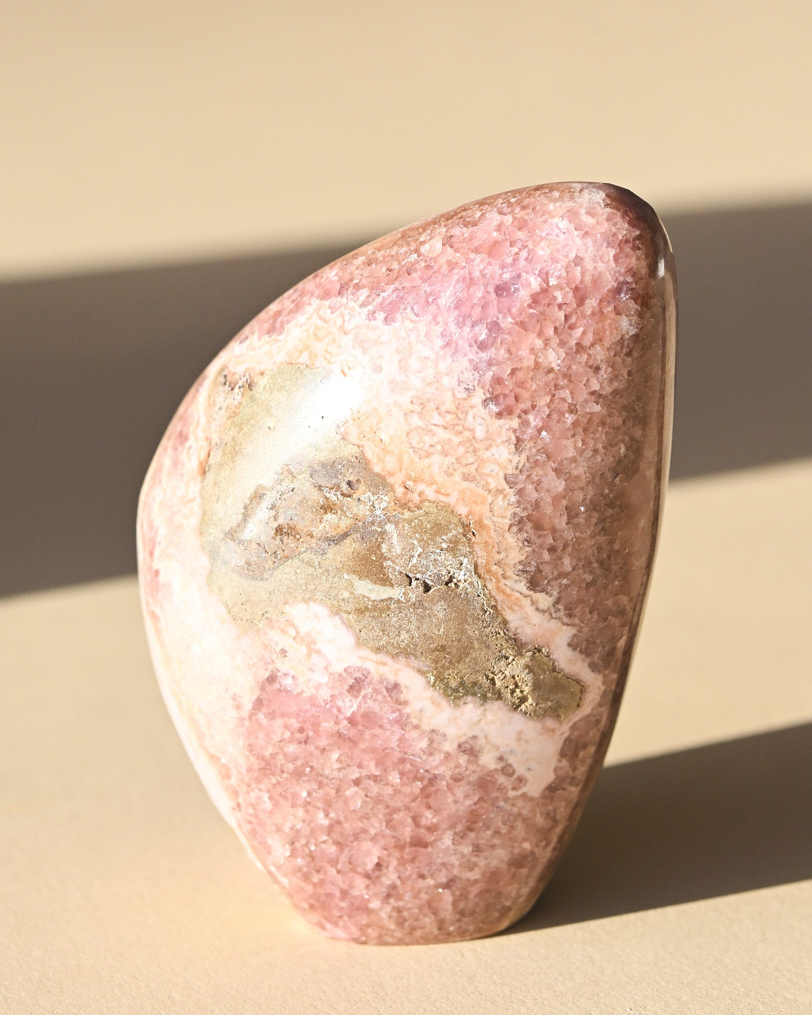 Rhodochrosite Polished Freeform 3in - pyrite crystal freeform sculpture scale view
