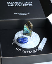 Crystal set with a labradorite stone, blue crystal, and white crystal on a branded crystal box.