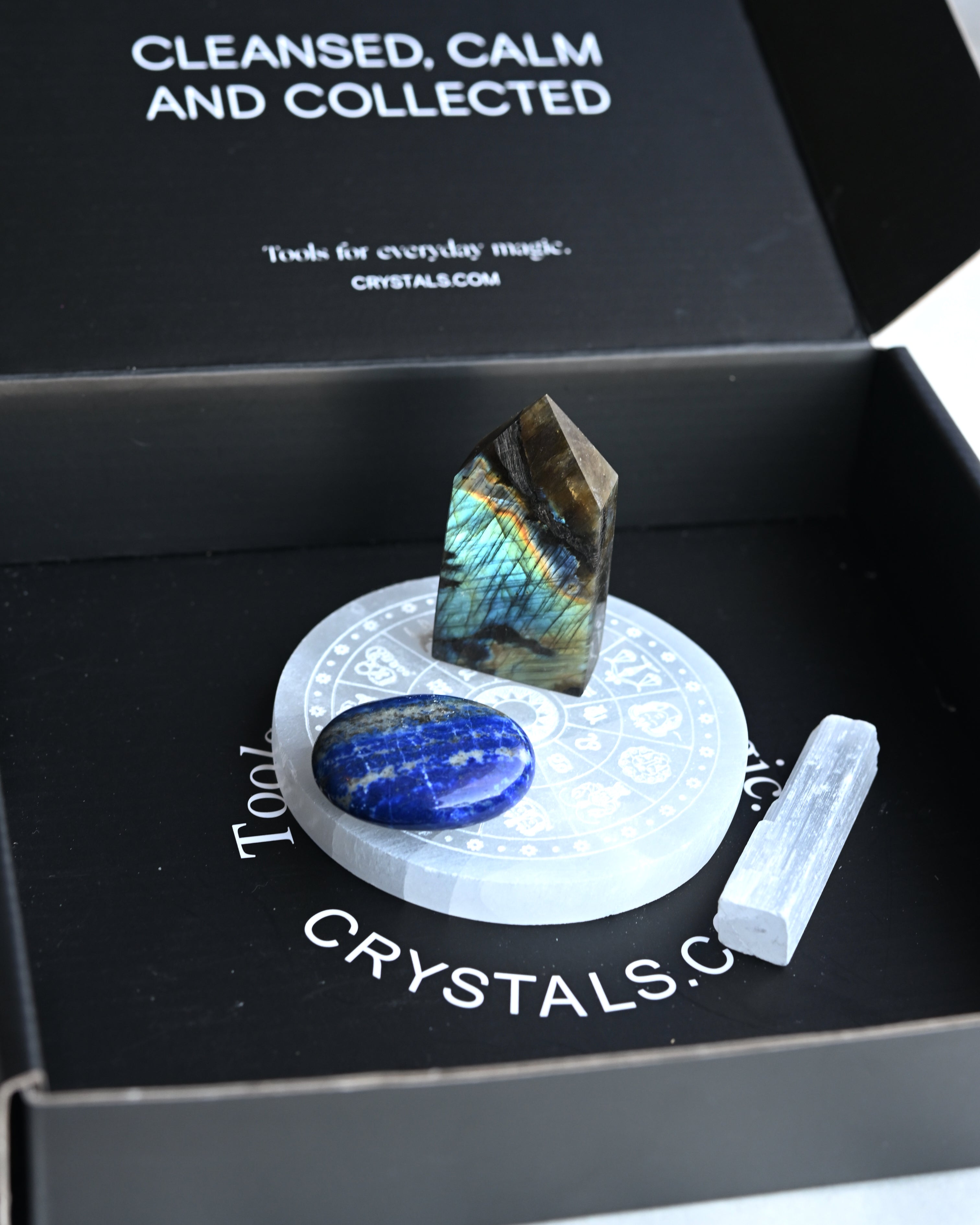 Crystal set with a labradorite stone, blue crystal, and white crystal on a branded crystal box.