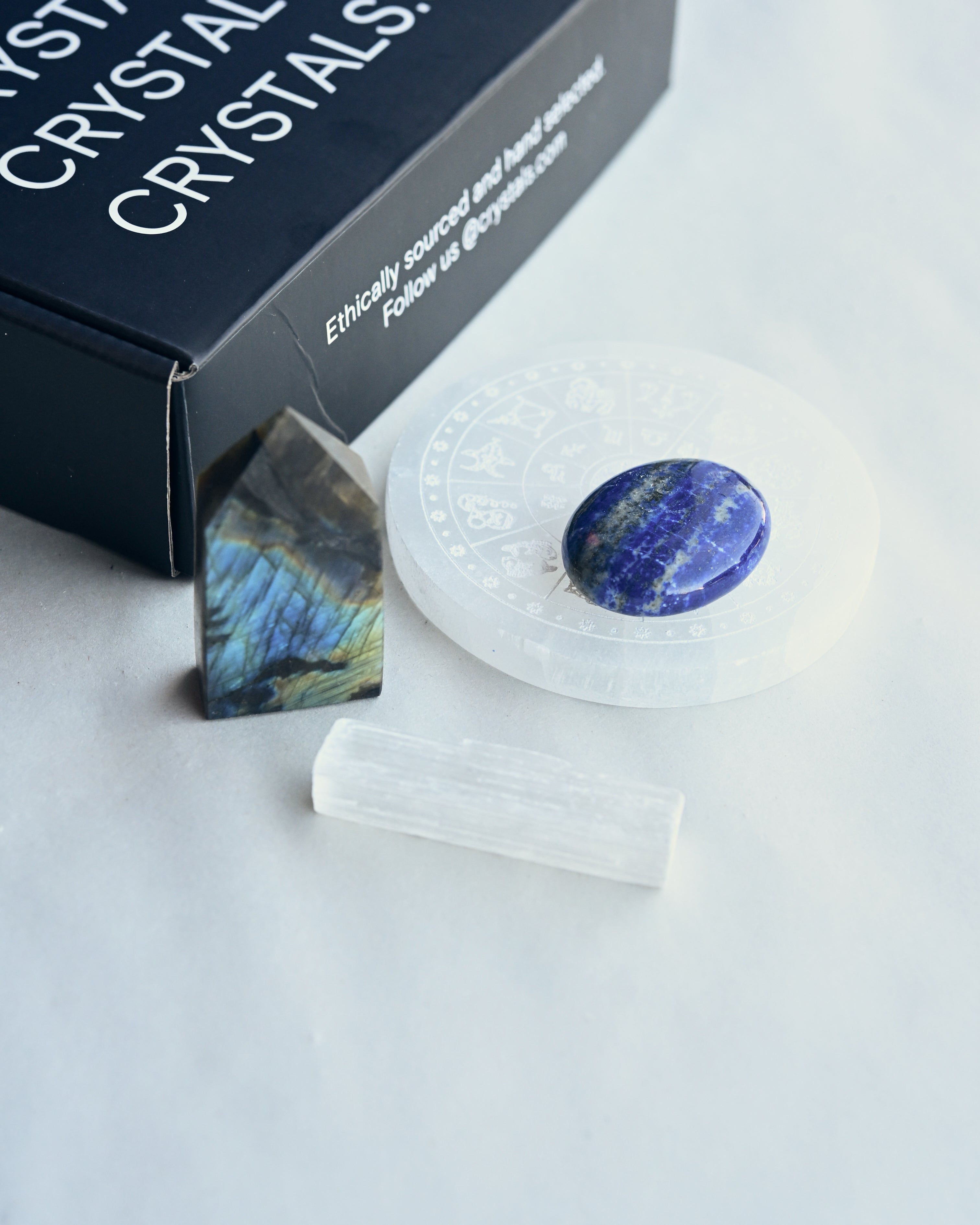 Crystal stones with a branded box in the background