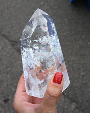 Clear quartz tower with rainbow inclusions Brazil