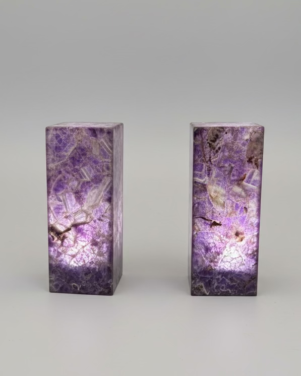 Amethyst crystal lamps on a table with a blurred background