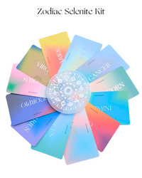 Zodiac Selenite Kit with colorful cards and a central wheel displaying zodiac signs on a white background.
