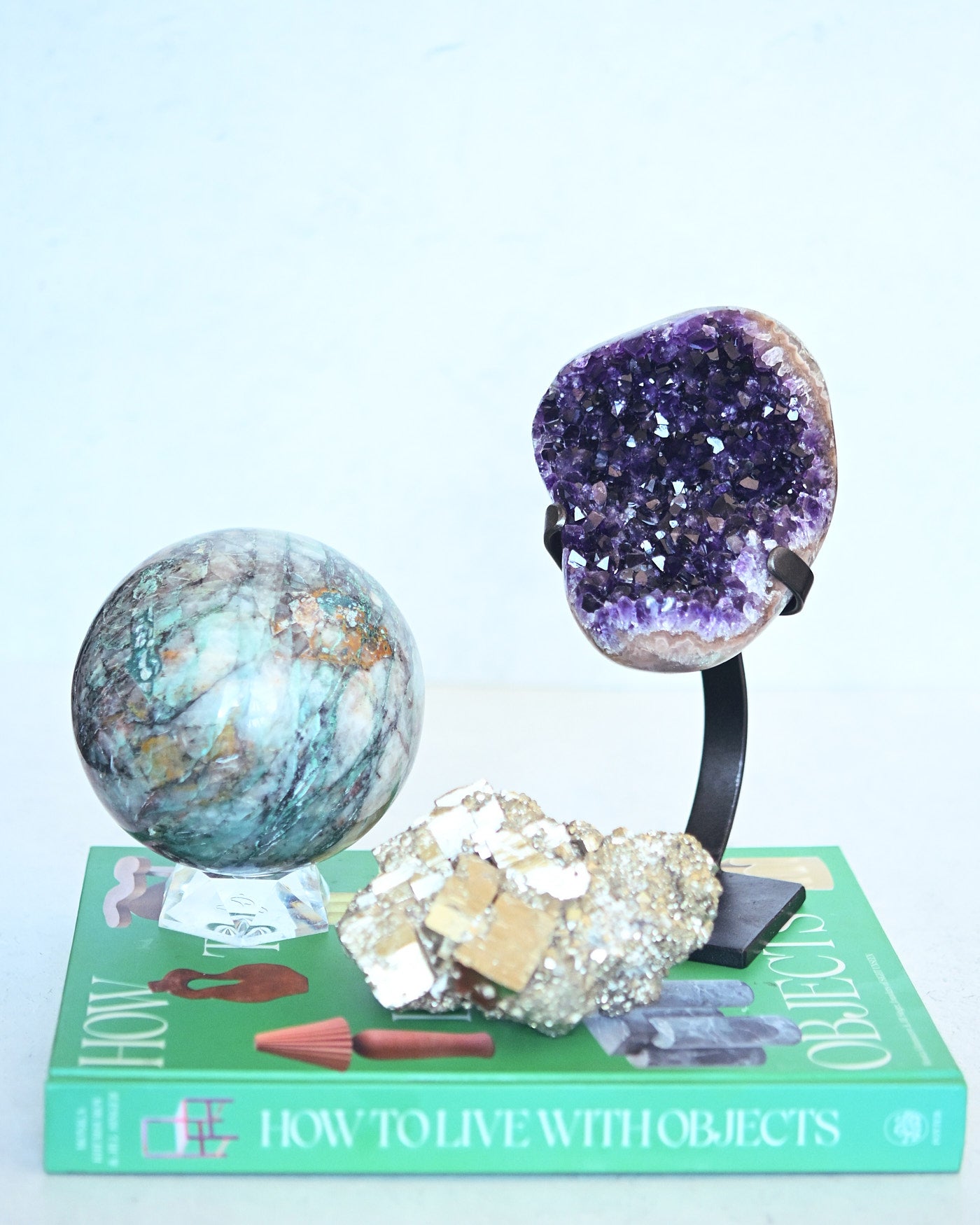Chrysocolla sphere, amethyst geode, and pyrite cluster trio