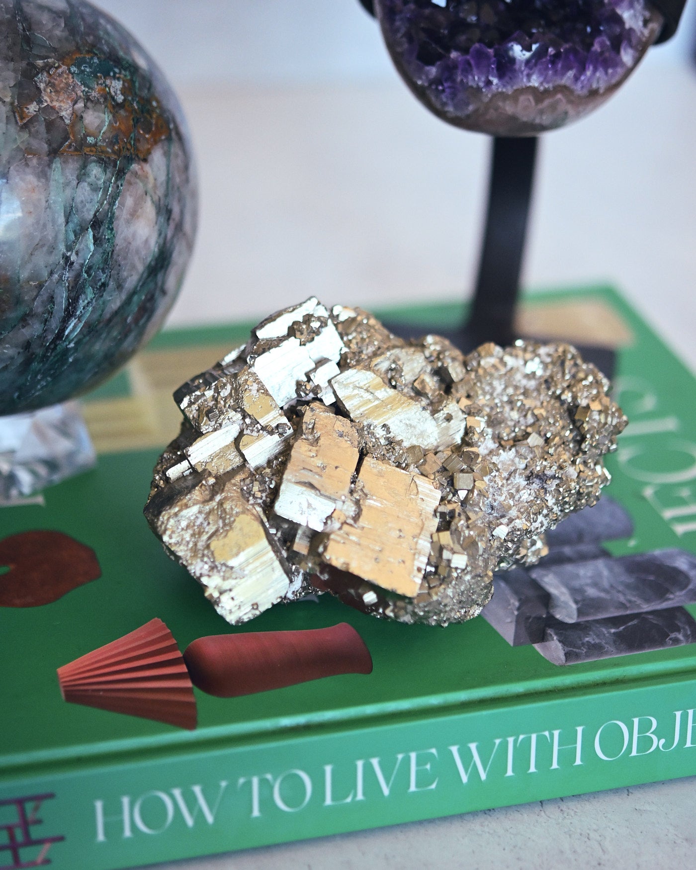 Cubic pyrite cluster detail with chrysocolla and amethyst