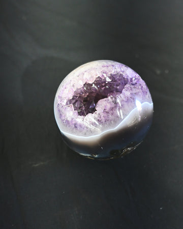 Amethyst Sphere – Brazil (760 g) - natural amethyst crystal sphere in natural light
