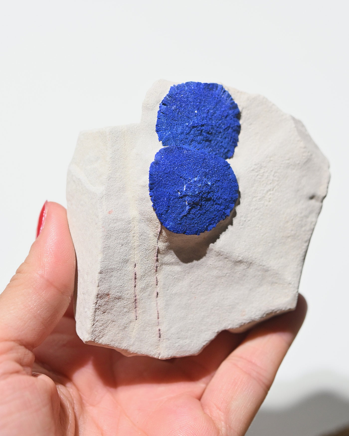Azurite mineral specimen side view showing blue copper carbonate crystals