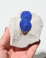 Azurite mineral specimen side view showing blue copper carbonate crystals