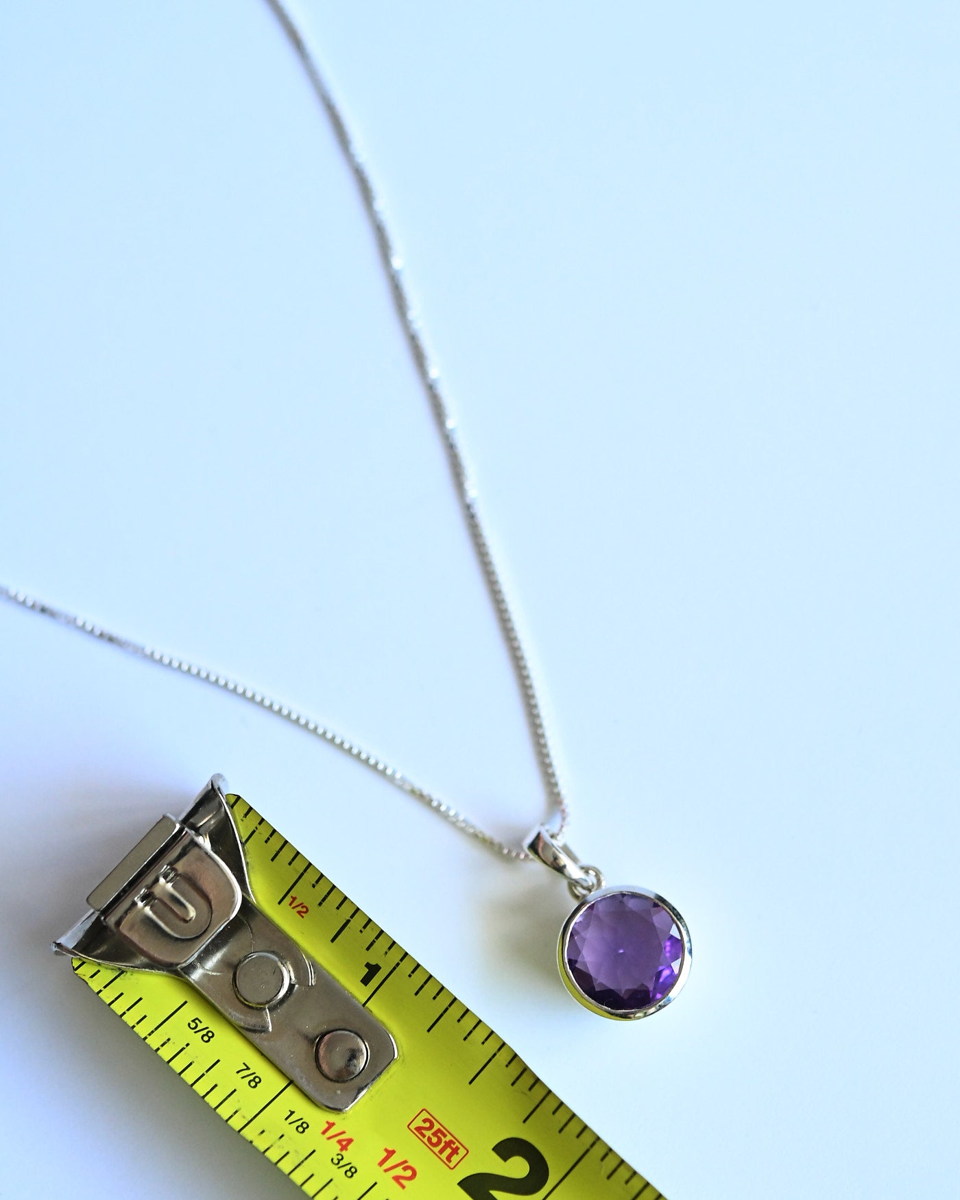 Amethyst Pendant size reference — approximately 1/2 inch diameter