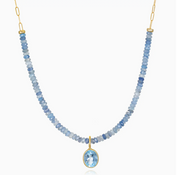 Necklace with blue beaded chain and gold pendant on a white background