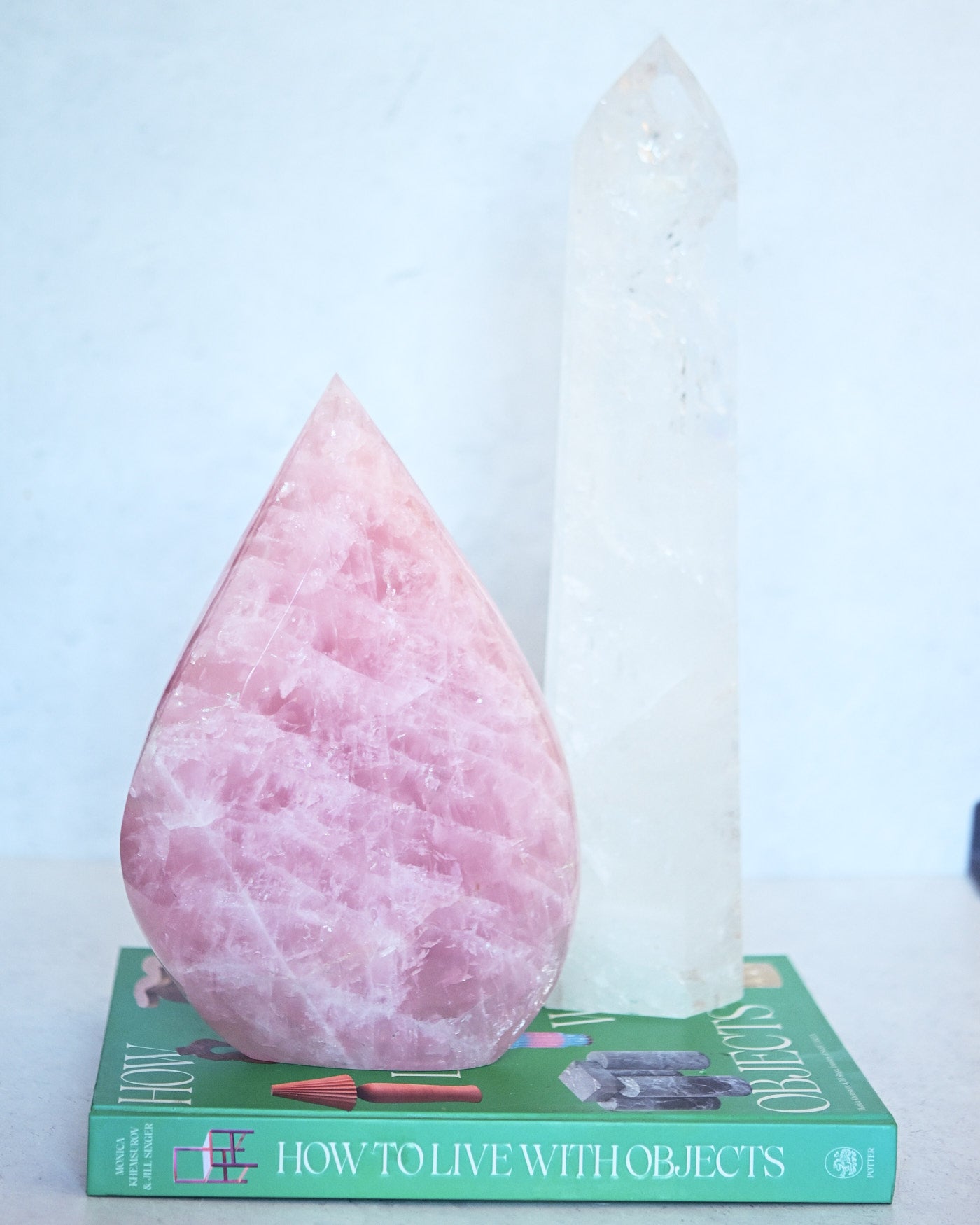 Curated crystal pair - statement rose quartz flame and clear quartz tower styled together