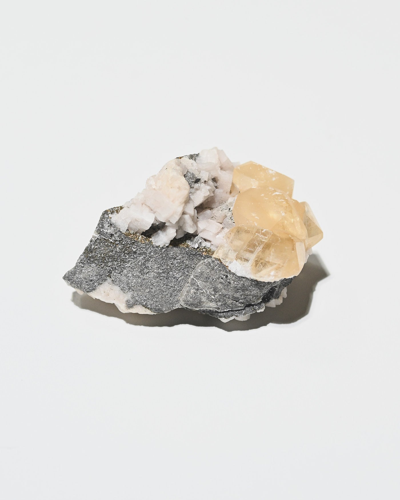 Canadian calcite specimen showing honey-colored transparent crystals