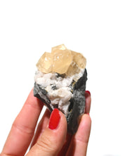 Raw calcite specimen from Canada, natural golden tones