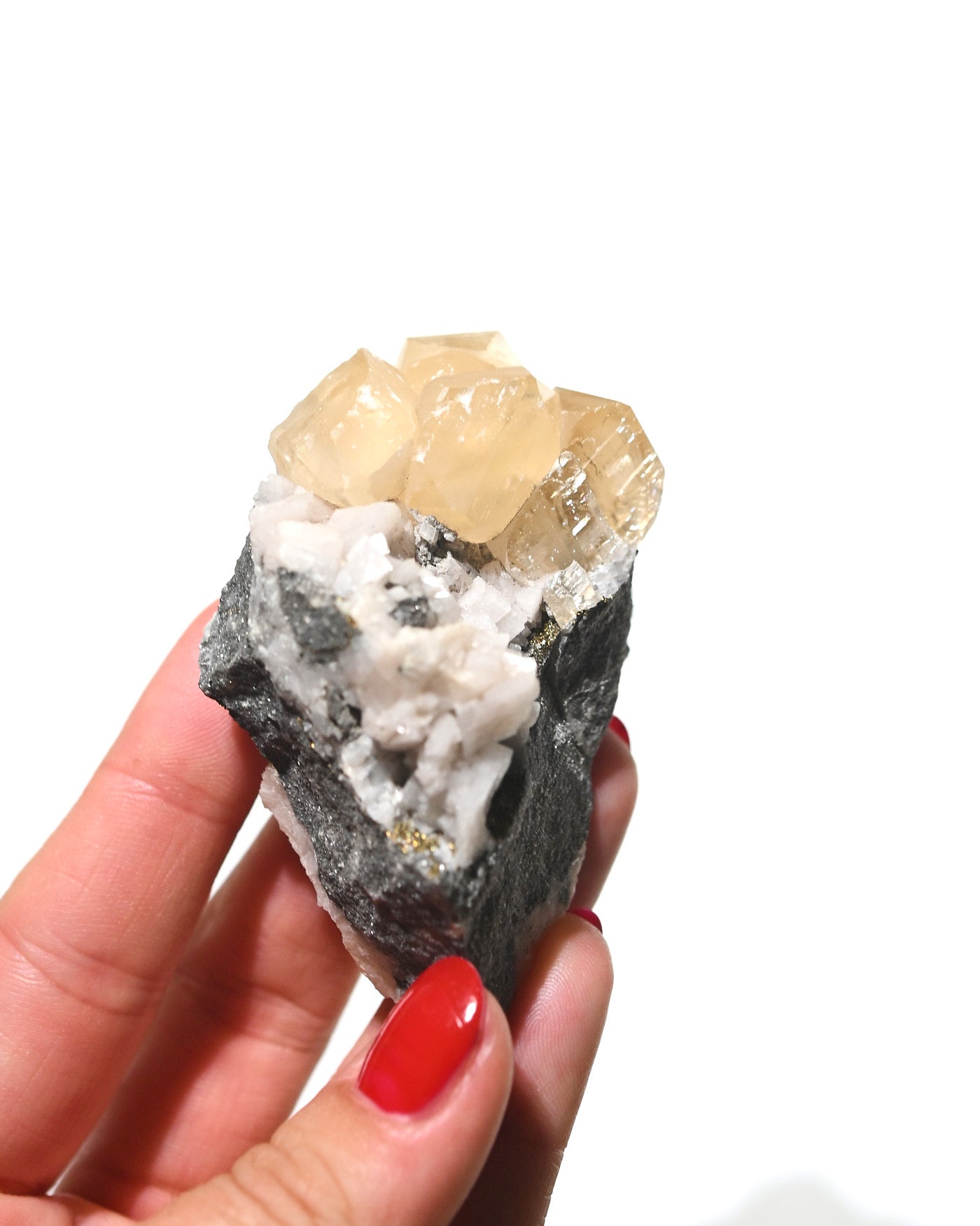 Calcite crystal cluster side view showing rhombohedral cleavage