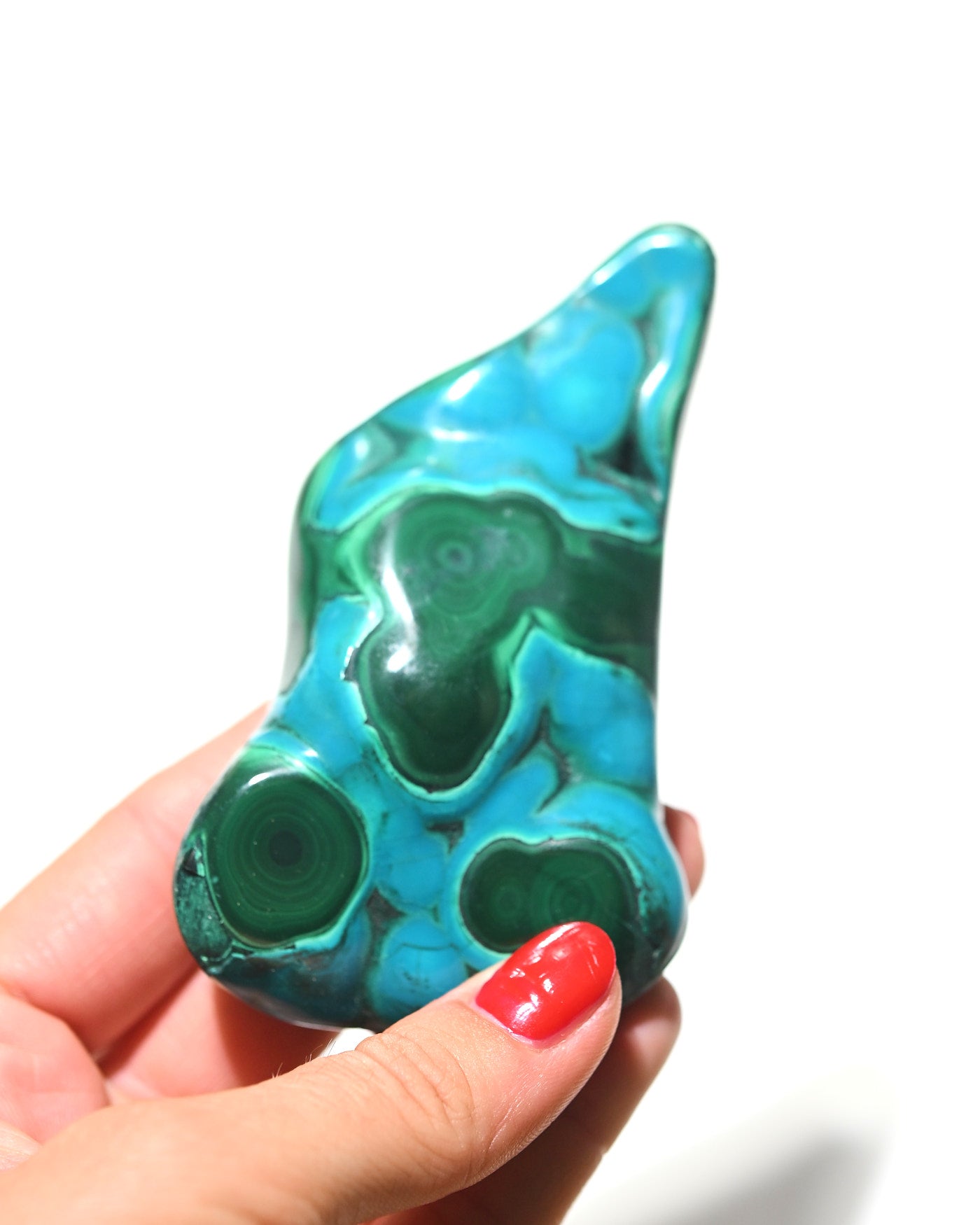 Chrysocolla Malachite freeform held in hand for scale