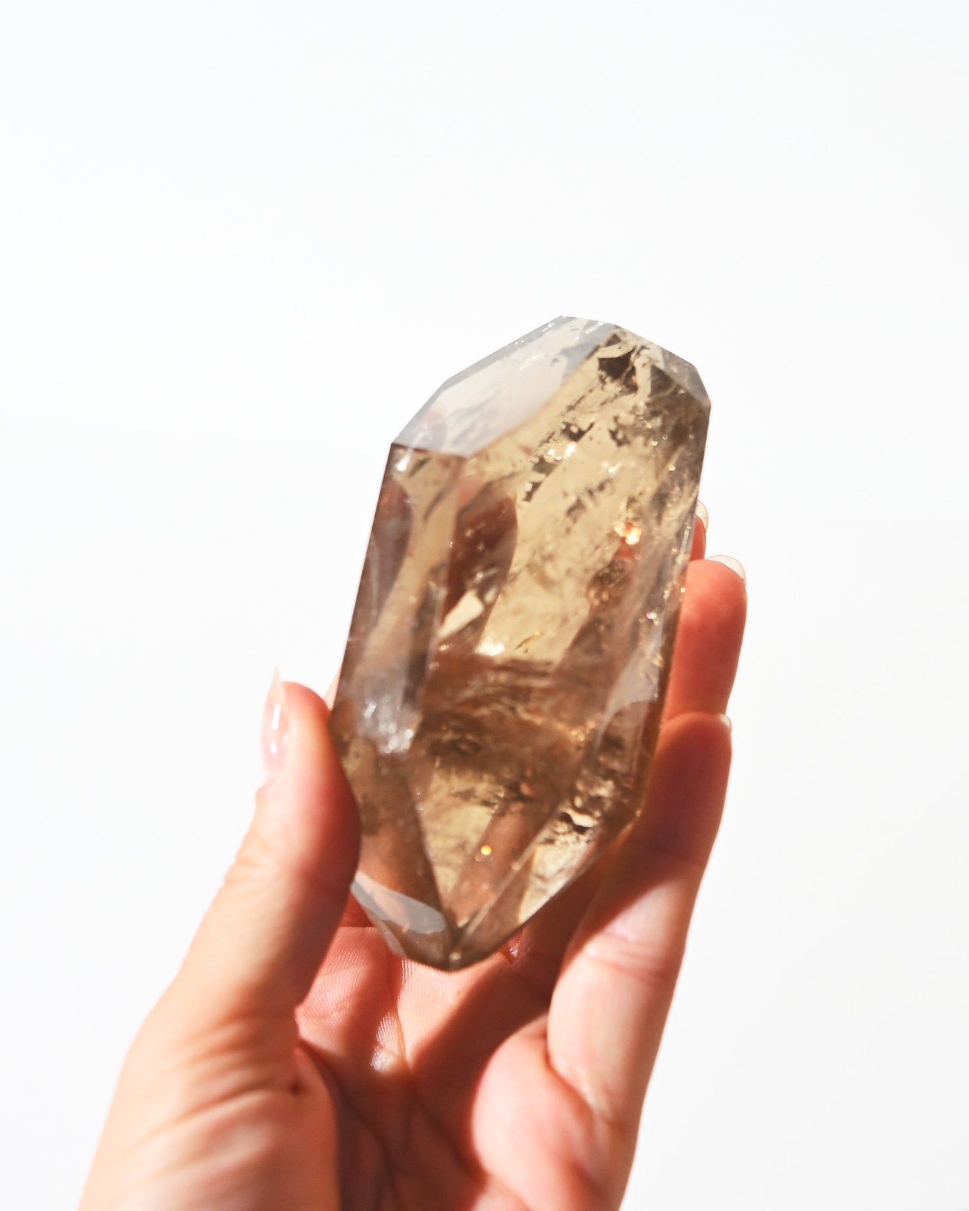 Natural smoky citrine point showing gem clarity