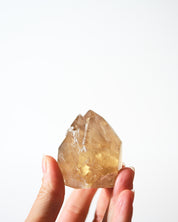 Citrine Twin Point Tower 114g in hand