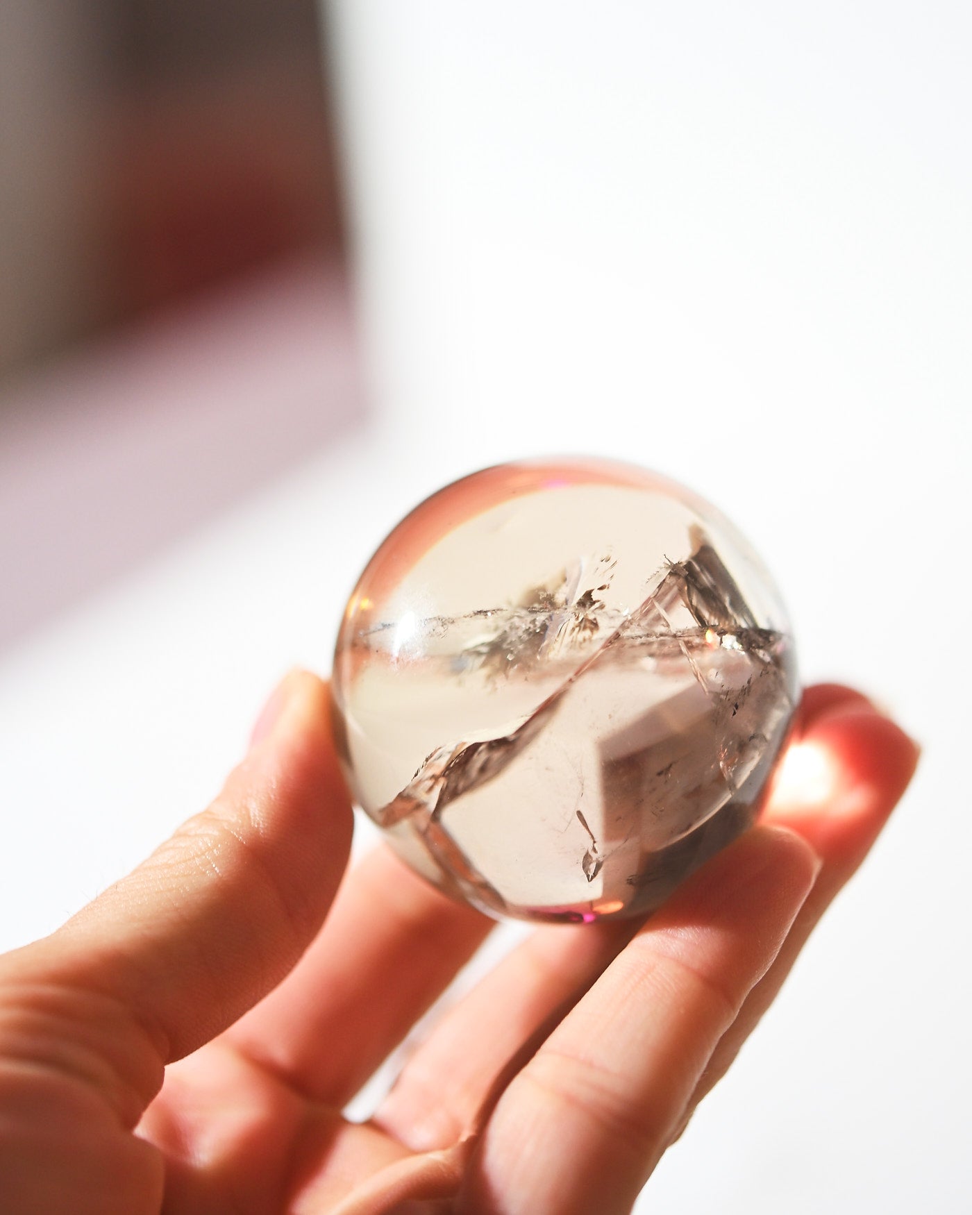 Smoky Citrine Sphere 160g in hand light