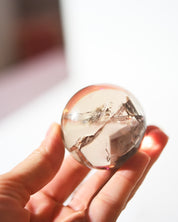 Smoky Citrine Sphere 160g in hand light