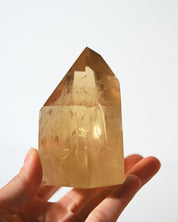 Citrine Tower 459g in hand for scale
