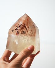 Natural citrine tower with iron oxide inclusions, 670g, hand-held view