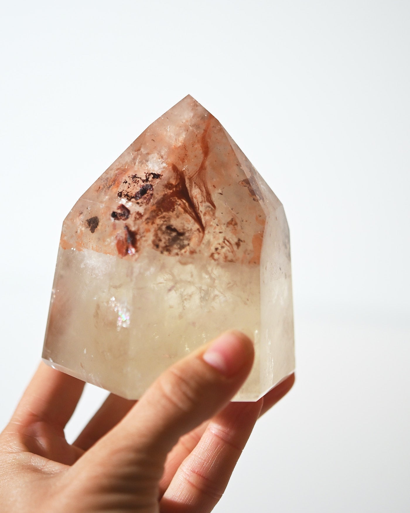Natural citrine tower with iron inclusions, hand-held detail