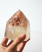 Natural citrine tower with iron inclusions, hand-held detail