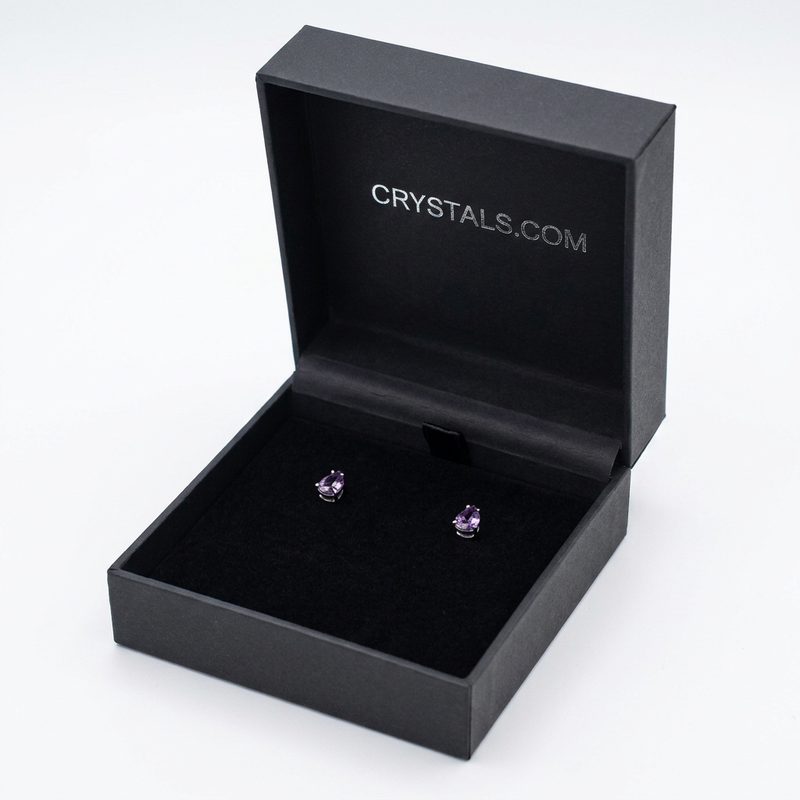 Amethyst teardrop stud earrings in CRYSTALS.COM jewelry box - angle view