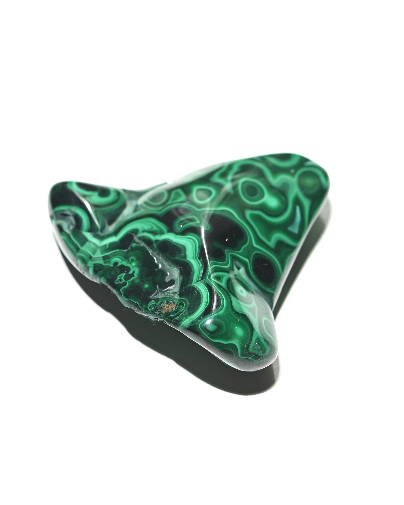 Malachite freeform with swirling green banding patterns