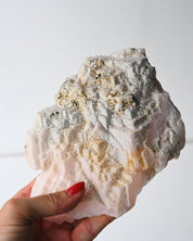 Manganoan calcite with pyrite held in hand