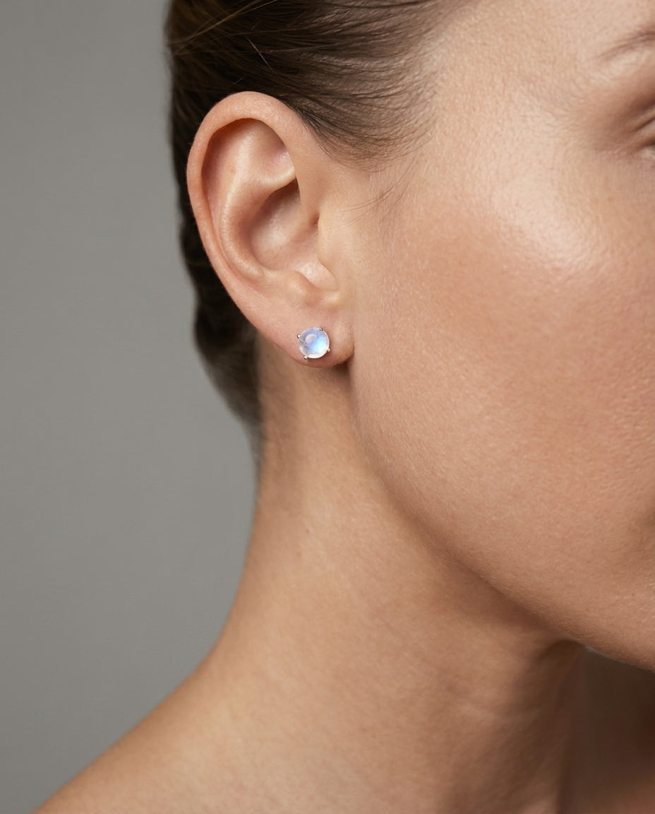 Rainbow moonstone stud earrings in sterling silver worn on model