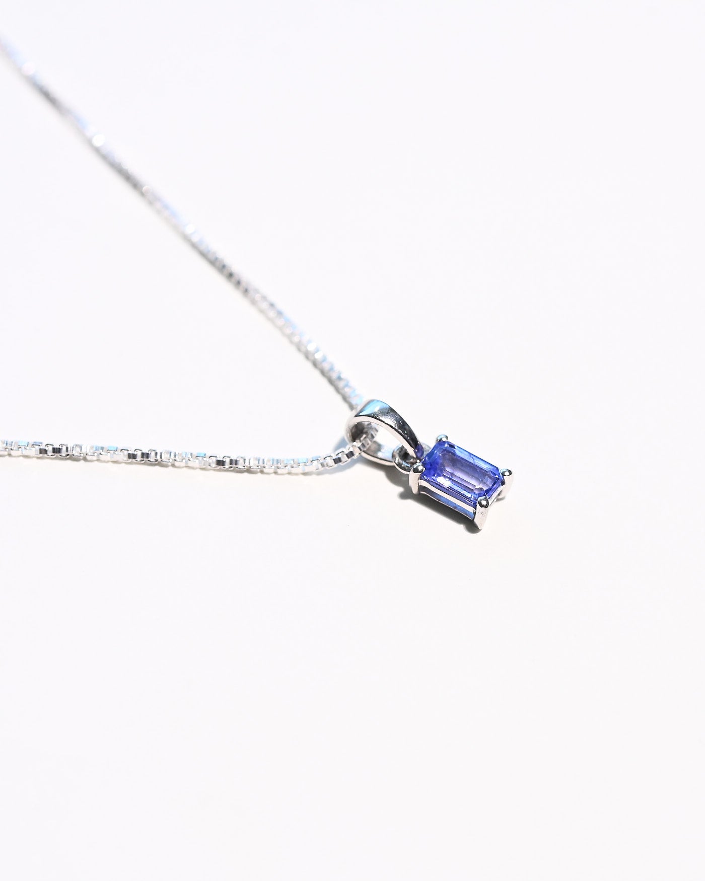 Emerald-cut tanzanite necklace close-up