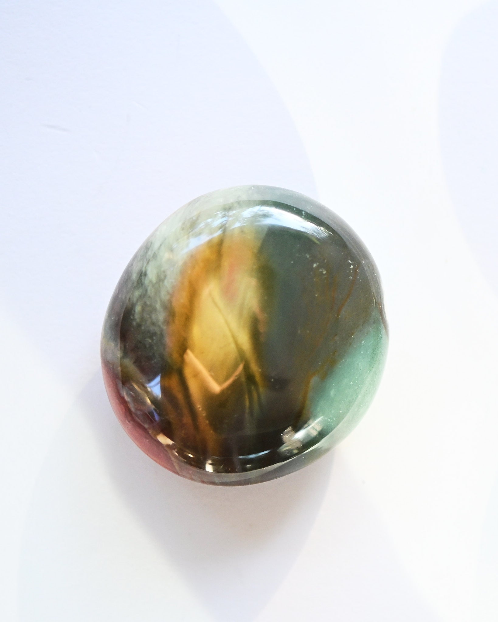 Polychrome Jasper palm stone - jasper crystal palm stone in natural light