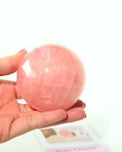 Gemmy Rose Quartz Sphere in hand