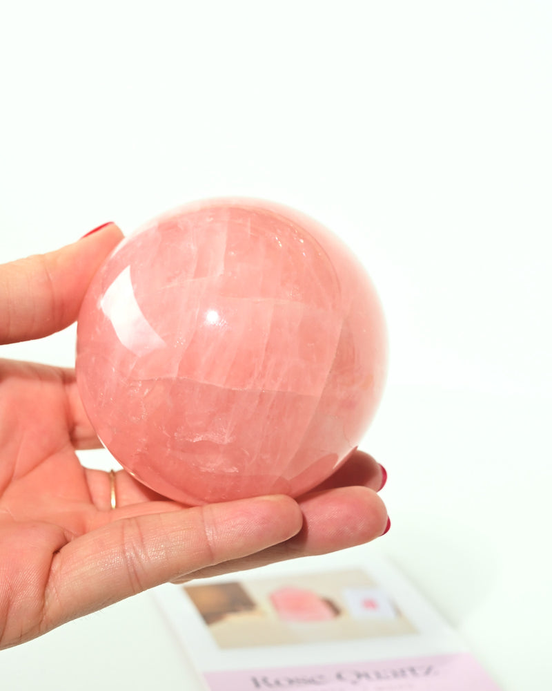 Gemmy Rose Quartz Sphere in hand