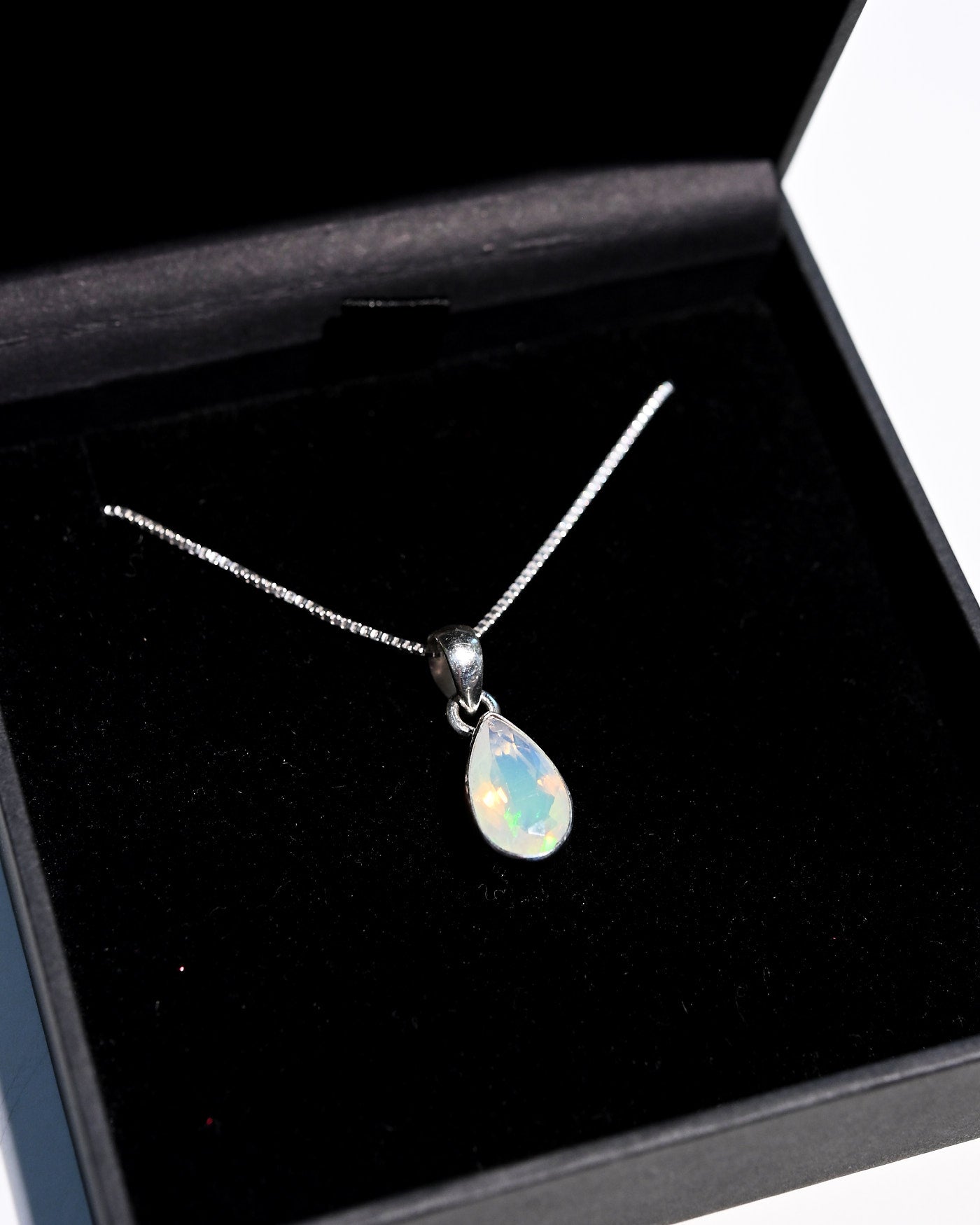 Opal teardrop pendant on adjustable sterling silver box chain