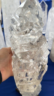 Statement clear Quartz wavy a treat form on stand