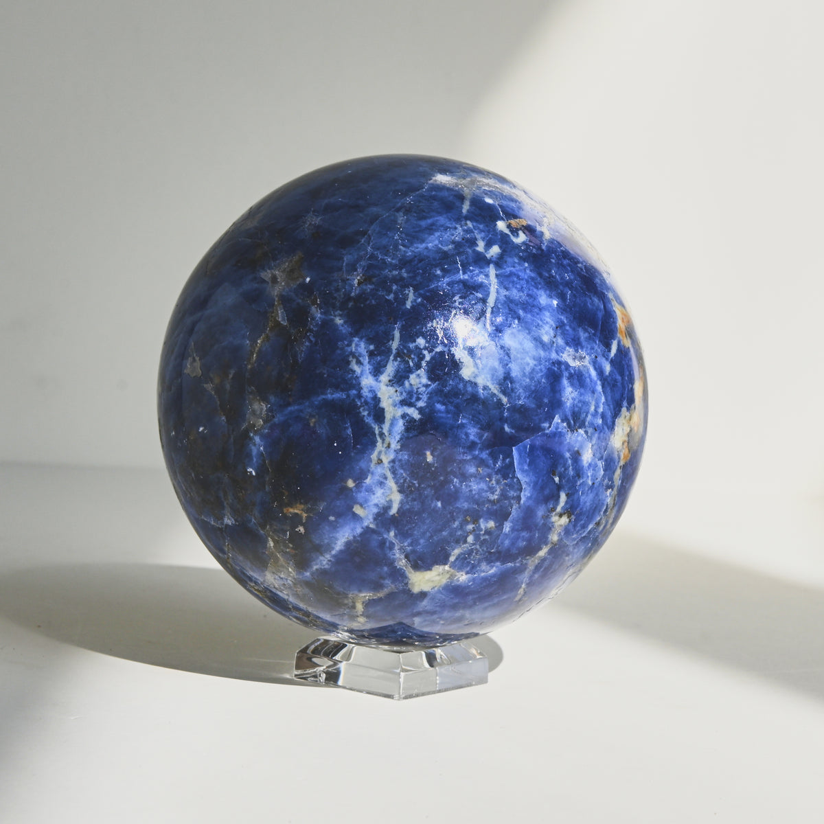 Sodalite crystal — Deep blue with white calcite veining specimen, Cubic crystal system