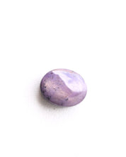 Natural star sapphire cabochon with six-rayed asterism, lavender-purple color