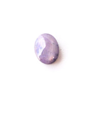 Star sapphire cabochon showing star effect under light