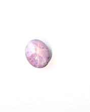 Star sapphire gem showing translucency and purple hue