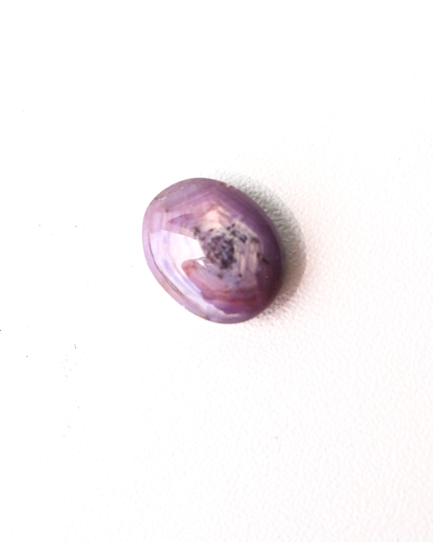 Lavender star sapphire loose gemstone close-up